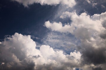 Puffy white clouds against a blue sky