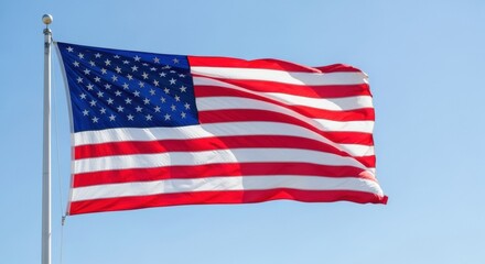 Fototapeta premium Vivid American Flag Waving on a Bright Clear Day