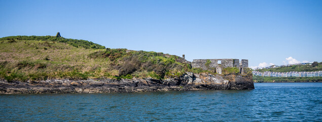 Kinsale, Ireland, May 20, 2024: Charles Fort British Fortress Ruins on Kinsale Bay with Rock Walls and Ramparts making up the castle and the Bay Defence  from the Bay