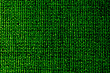 Green upholstery fabric texture with cross weave, burlap background
