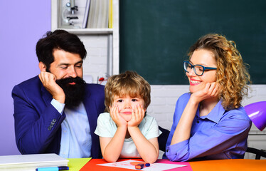 Private lesson. Pupil of primary school having lesson with private tutors. Elementary school...