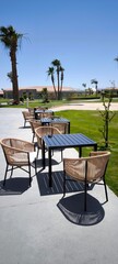 Summer outdoor cafe: empty tables and chairs