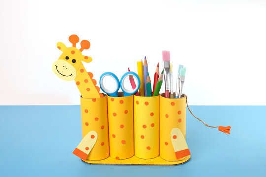 Creative giraffe-themed pencil organizer for classroom decoration, parenting blogs, children gifts, toy store marketing, craft tutorial content, and early education product mockups - Powered by Adobe
