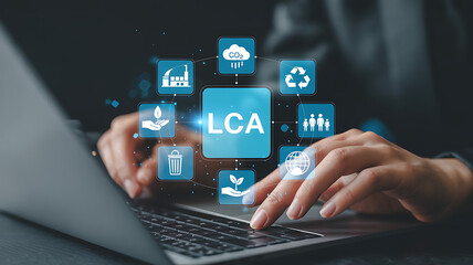 Person typing on a laptop with life cycle assessment icons floating around the screen