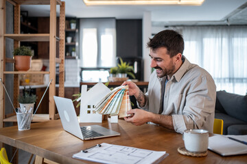 Architect choosing colour palette during online meeting from home office