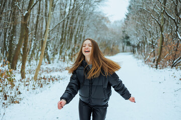 A girl with bright eyes joyfully runs through a magical winter wonderland, radiating happiness and...