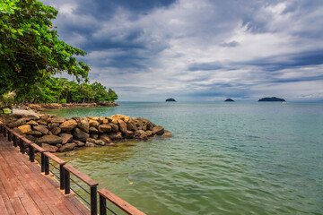 Wooden boardwalk at one of the hotels under a gloomy dramatic sky