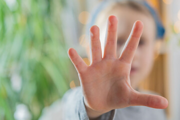Young Child, girl raising hand in 