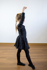 young girl in black dress performing ballet dance, dance performance, childhood memories, artistic...