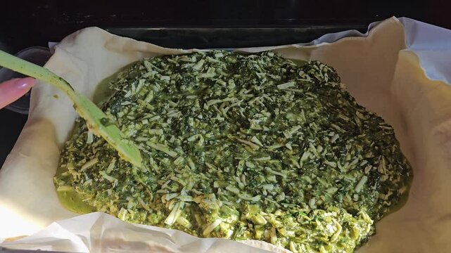 Delicious Homemade cheesy spinach quiche pie. spinach pie making process