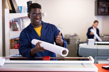 Positive typography technician offering plotter paper roll