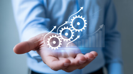 A hand holding gears with arrows and a bar graph representing growth and efficiency
