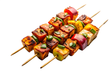 Paneer tikka skewers with bell peppers and onions grilled on wooden sticks isolated on a transparent background