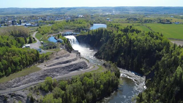 Aerial view of the Mitis-1 dam hydroelectric power station built over a natural waterfall on the famous salmon sport fishing Mitis River in Price, Quebec, Canada.