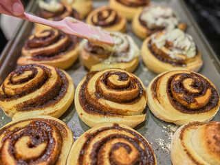 Homemade cinnamon rolls with cream cheese, top veiw. homemade pastry - cinnabons for breakfast or...