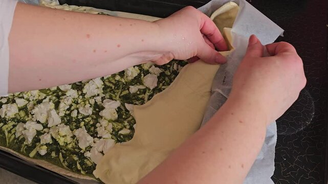 Delicious Homemade cheesy spinach quiche pie. spinach pie making process