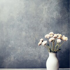Elegant white flowers in a simple vase on a table