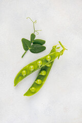 Fresh green peas on a white background, healthy snack