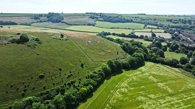 Aerial shot of the Cerne Abbas Giant, a chalk figure on a hillside in Dorset, UK