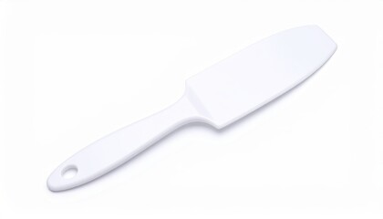 Fototapeta premium Clean white plastic spatula with hanging hole on a bright white background