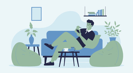 Fototapeta premium Man Relaxing On Sofa And Working With Tablet At Home