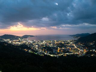 Obraz premium Aerial view of beautiful sunset sky over sea at Patong bay Phuket city Thailand