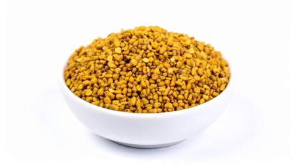 Fenugreek seeds overflowing in a white bowl, isolated on a white background.