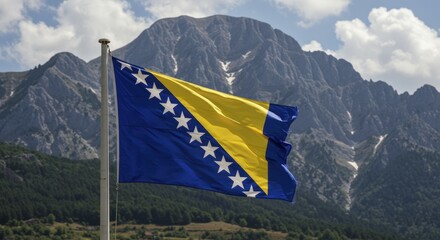 Bosnian Flag Waving in the Wind with Mountainous Backdrop and Cl