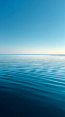 Obraz premium Tranquil sea and sky symmetry: perfect horizon line in vertical frame for serene wall art