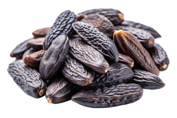 Close up heap of dark brown tonka beans with textured surfaces isolated on a transparent background dipteryx odorata