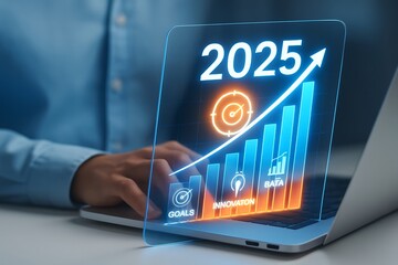 Business professional analyzing a glowing holographic display showing a financial growth chart for the year 2025 with icons for goals and innovation
