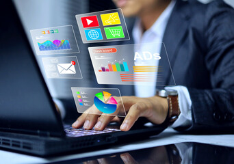 Digital marketing advertisement concept with businessman working on laptop computer to check advertisement dashboard on digital market platform
