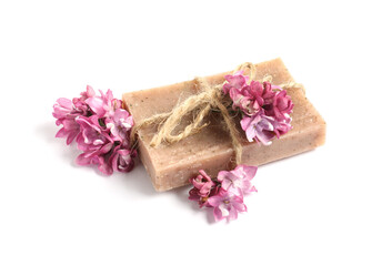 Soap bar and lilac flowers isolated white