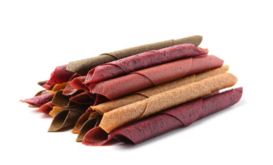 Delicious fruit leather rolls on white background