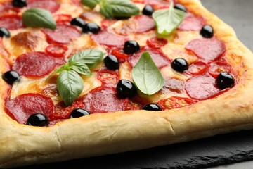 Tasty homemade pizza on grey table, closeup