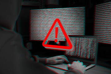 Cyber attack alert notification. Red warning sign on virtual screen. Hacker using laptop, closeup
