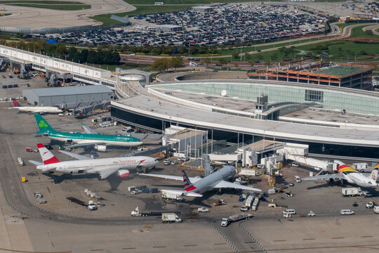 O'Hare Airport, Chicago, Illinois, USA - September 26, 2023 - Aerial view of Terminal 5 at Chicago's O'Hare Airport - ORD with from Air Lingus, Austrian Airlines, American Airlines, and Air Belgium 