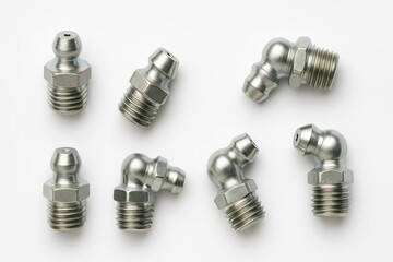 Six grease fittings two straight and four 90 degree angled metallic on white background