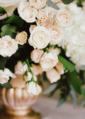 Beautiful floral arrangement featuring pale roses and greenery in an elegant vase for a special occasion