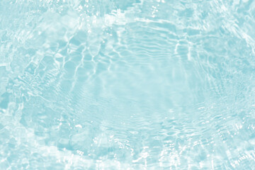 Blue water with ripples on the surface. Defocus blurred transparent blue colored clear calm water...