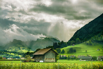 Farmland in a Swiss mountain storm