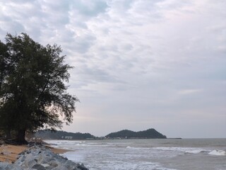 Experience the beauty of nature at its finest where waves crash onto the shore, creating a...