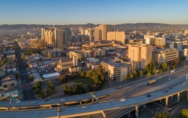 Aerial view of Oakland, California, USA, showcasing the city skyline, residential areas, and a busy...