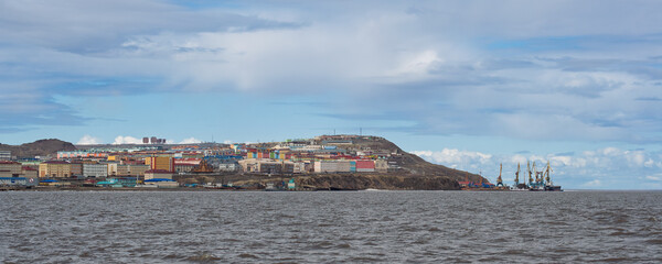 Panorama of the city of Anadyr. Anadyr is the administrative center of the Chukotka Autonomous Okrug, located on the right bank of the Anadyr Estuary. Multicolored residential buildings on the coast.