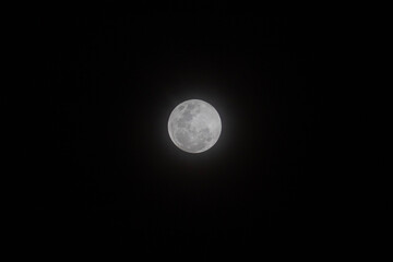 white shiny full moon with mist and dark background