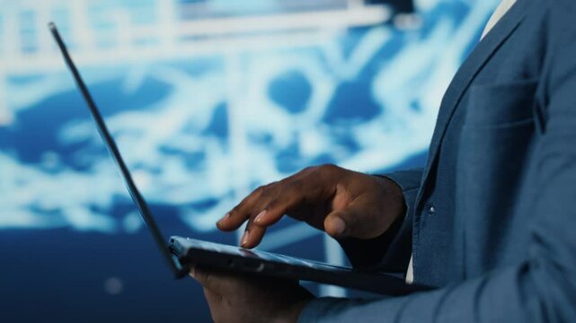 High tech concept of black IT professional exploring artificial intelligence, showcasing machine learning algorithms and systems, neural networks and futuristic data science. Camera A.