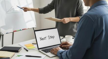 Business Meeting with Woman Presenting Graph and Man Using Laptop with Next Step Sign