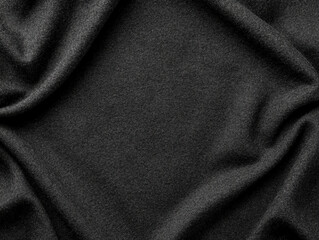 close-up view of black fabric with a subtle glittery texture and soft folds creating a luxurious and elegant appearance.