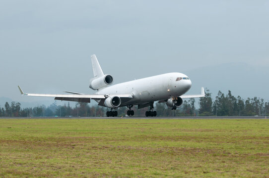 Cargo plane landing on a cloudy day