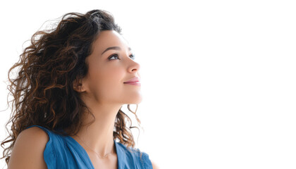 A young woman with curly hair gazes upward with a serene expression. standing against a bright white background. evoking feelings of hope and inspiration